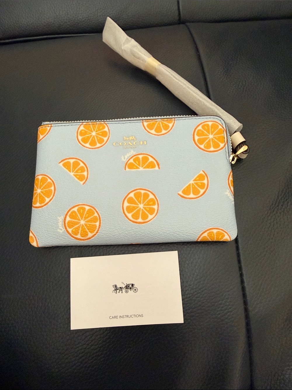 Coach Light Blue Wristlet with Orange Citrus Pattern